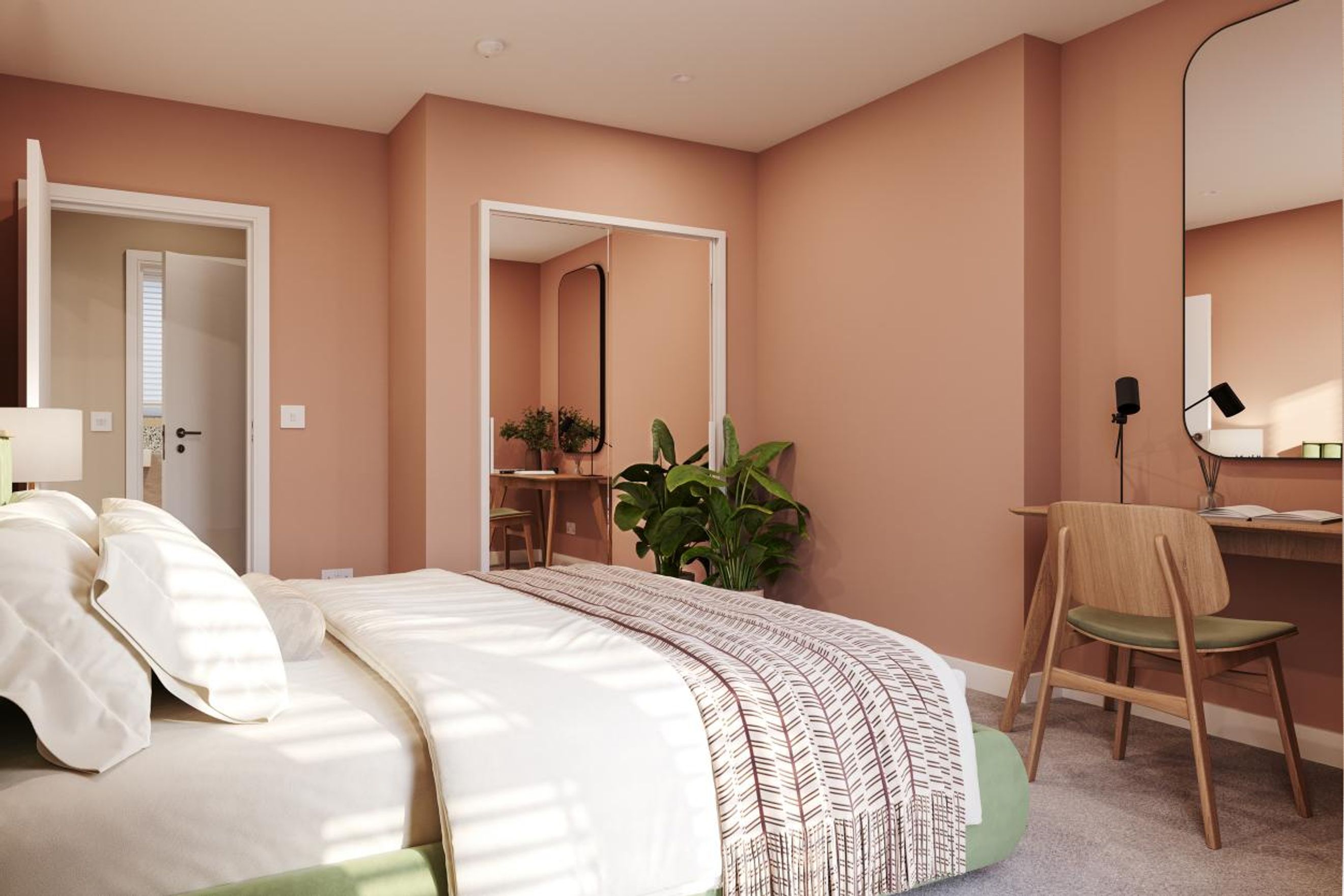 A bedroom with a bed, a vanity, and a wardrobe.