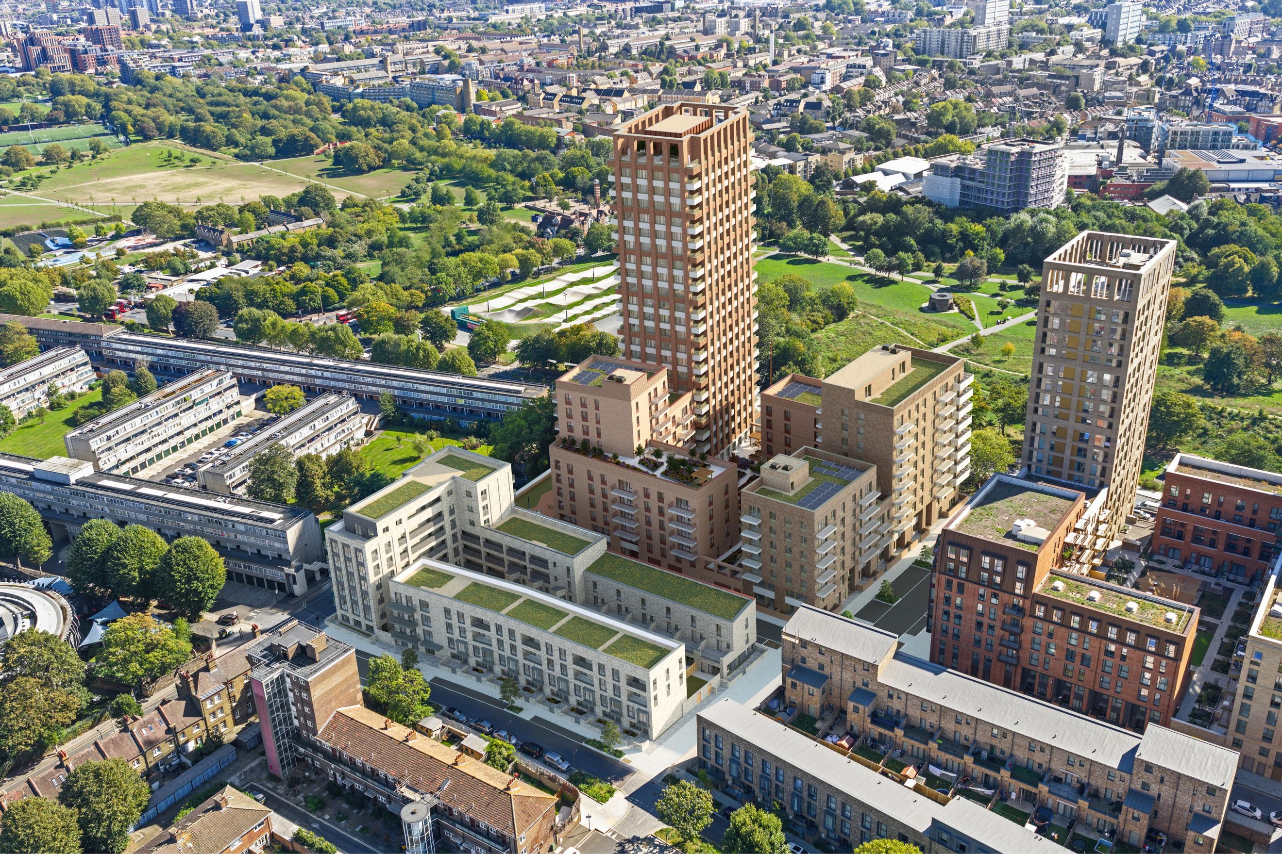 An aerial view of a modern urban development with several apartment buildings and townhouses.