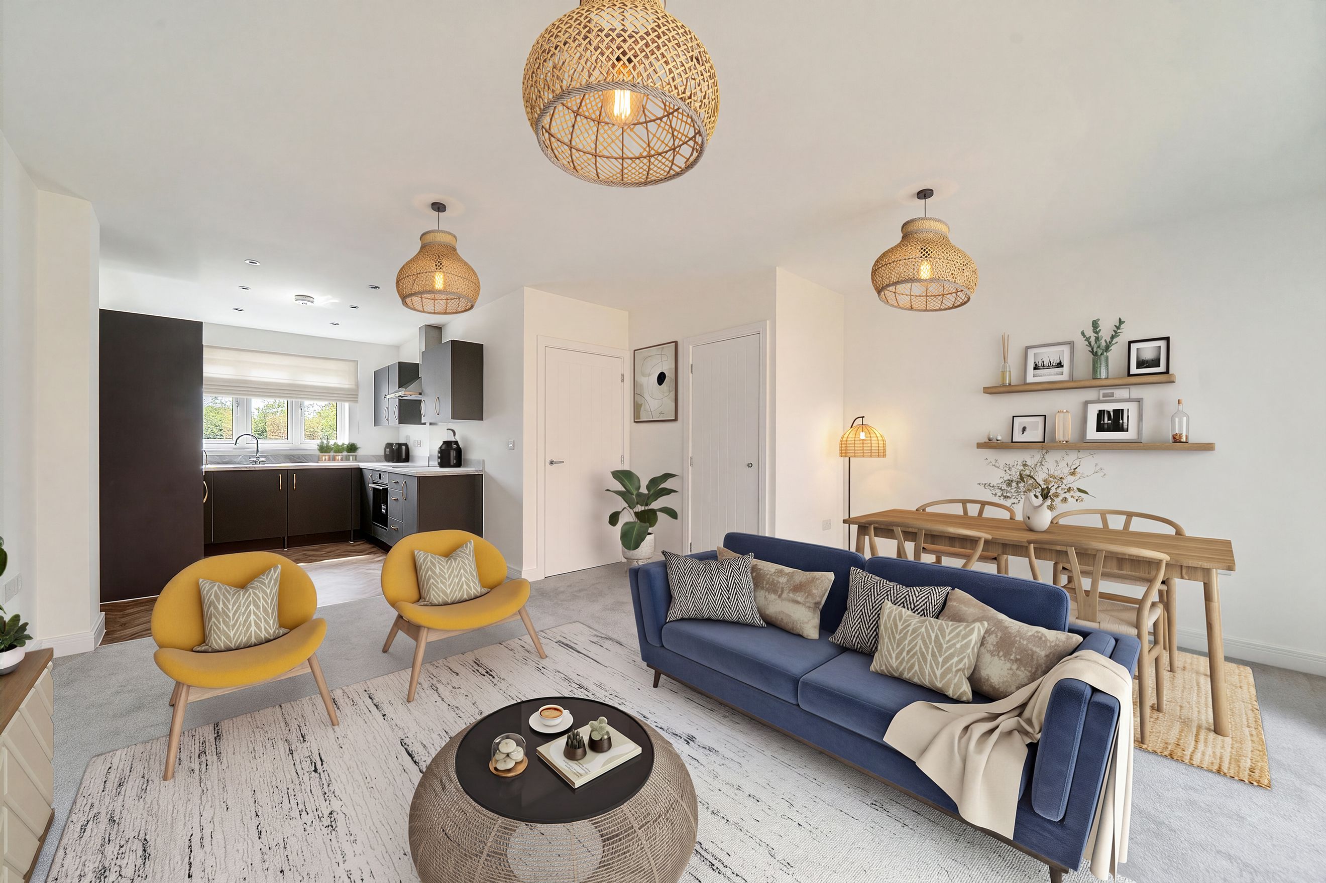 A living room and kitchen area with a blue sofa, yellow chairs, and a dining table.