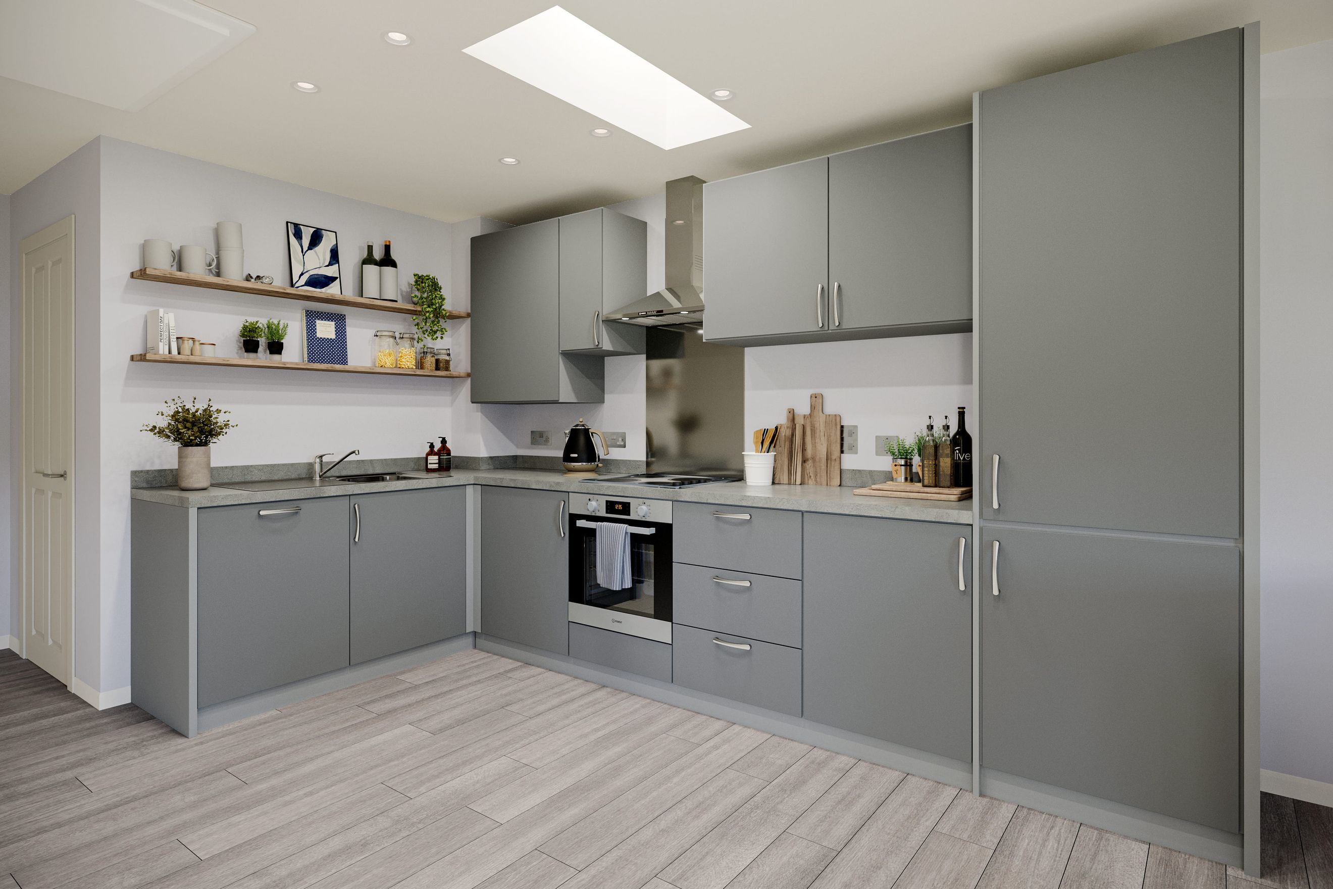 A modern kitchen with grey cabinets, a countertop, and an oven.
