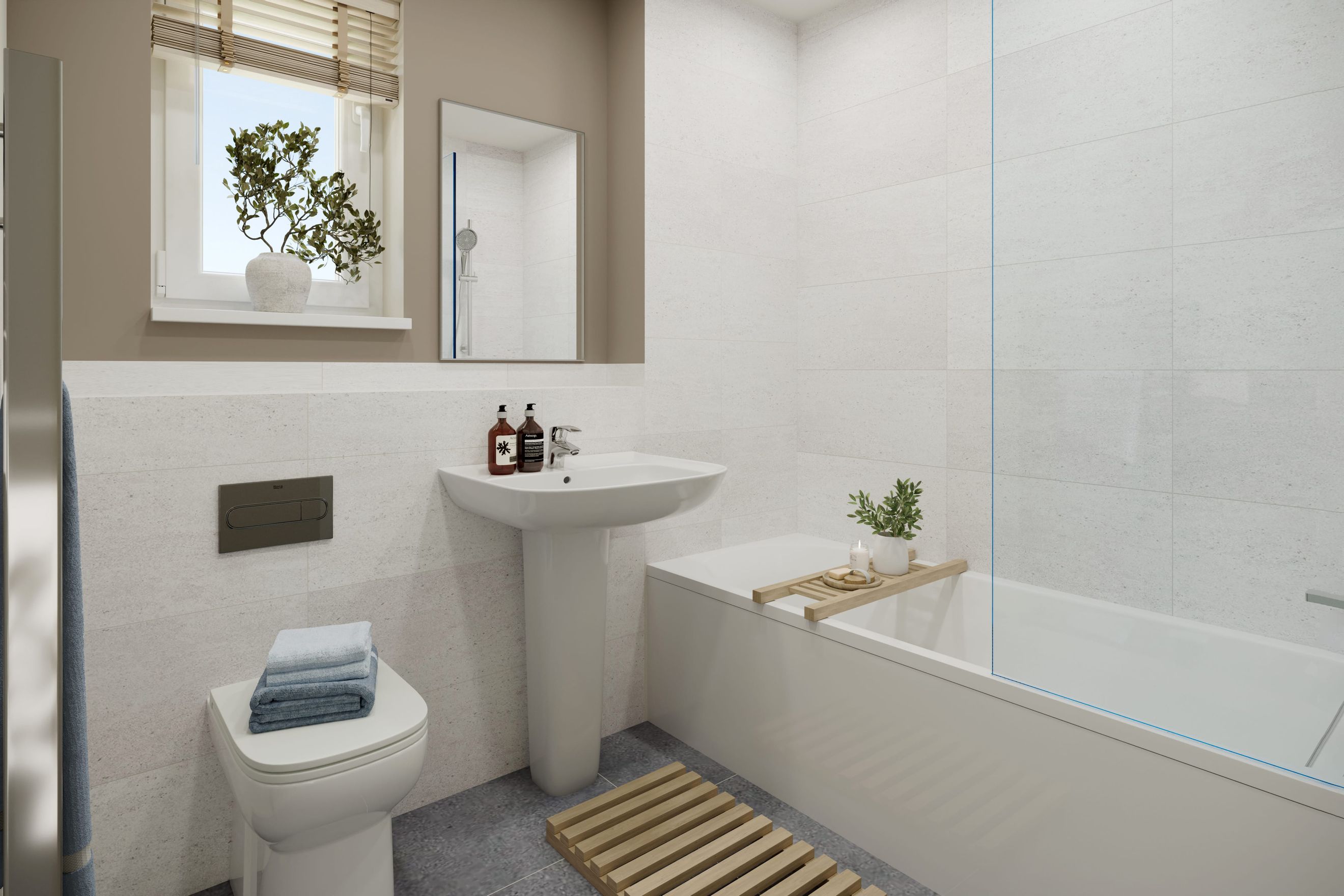 A bathroom with a toilet, sink, and bathtub.