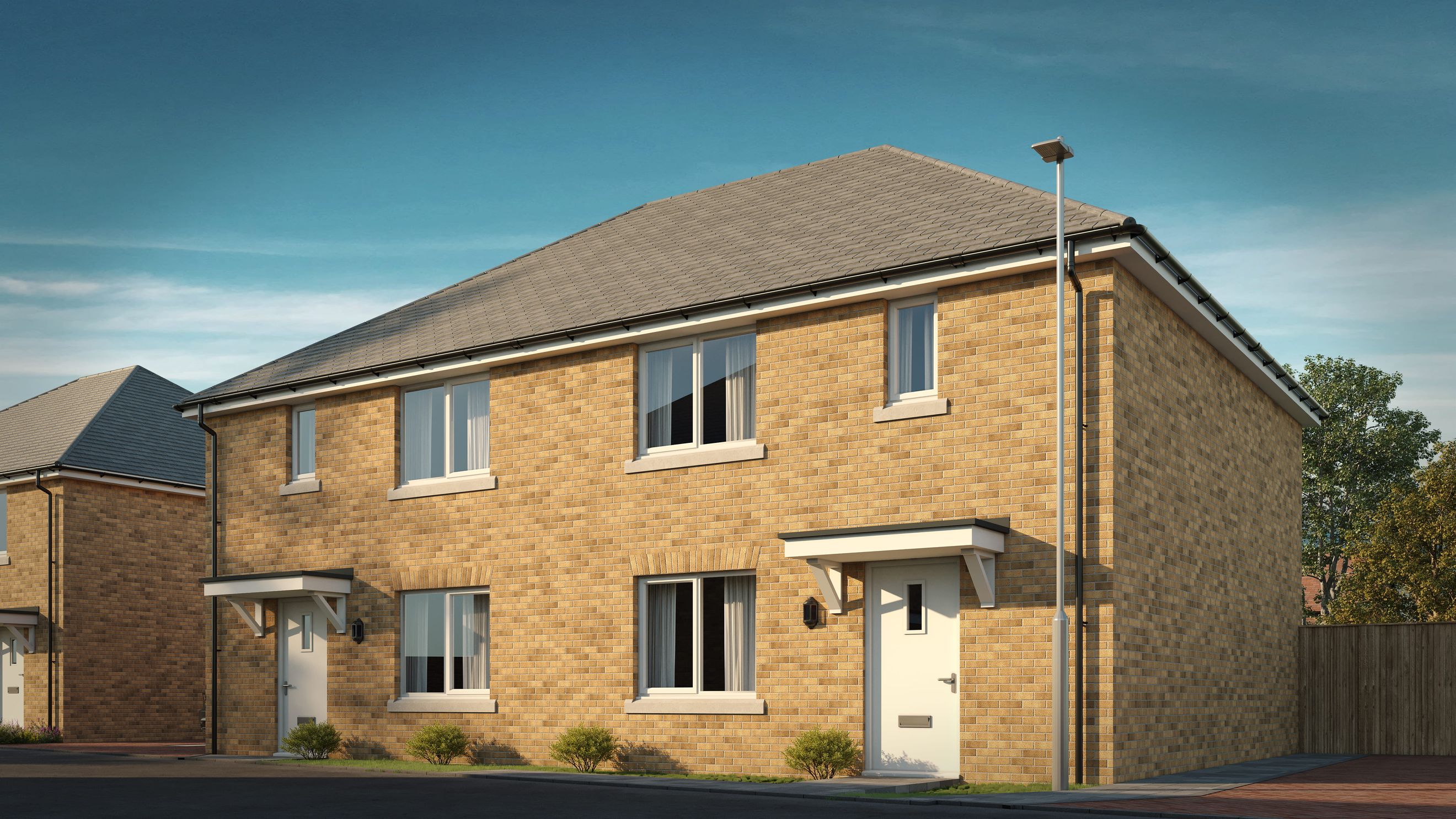 A pair of modern brick semi-detached houses with pitched roofs and white doors under a clear blue sky.
