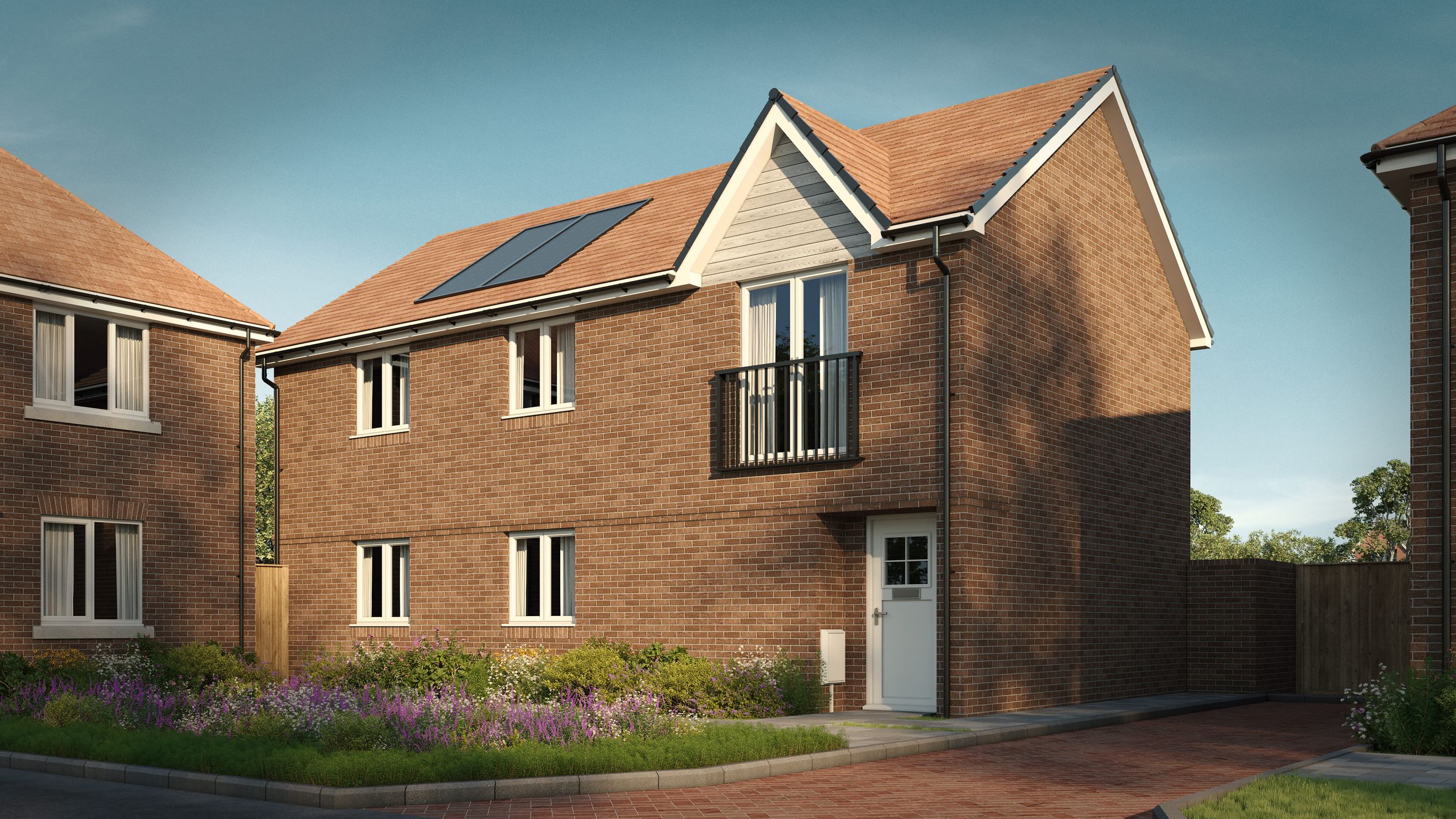 A two-story brick house with a tile roof, solar panels, and a front garden.