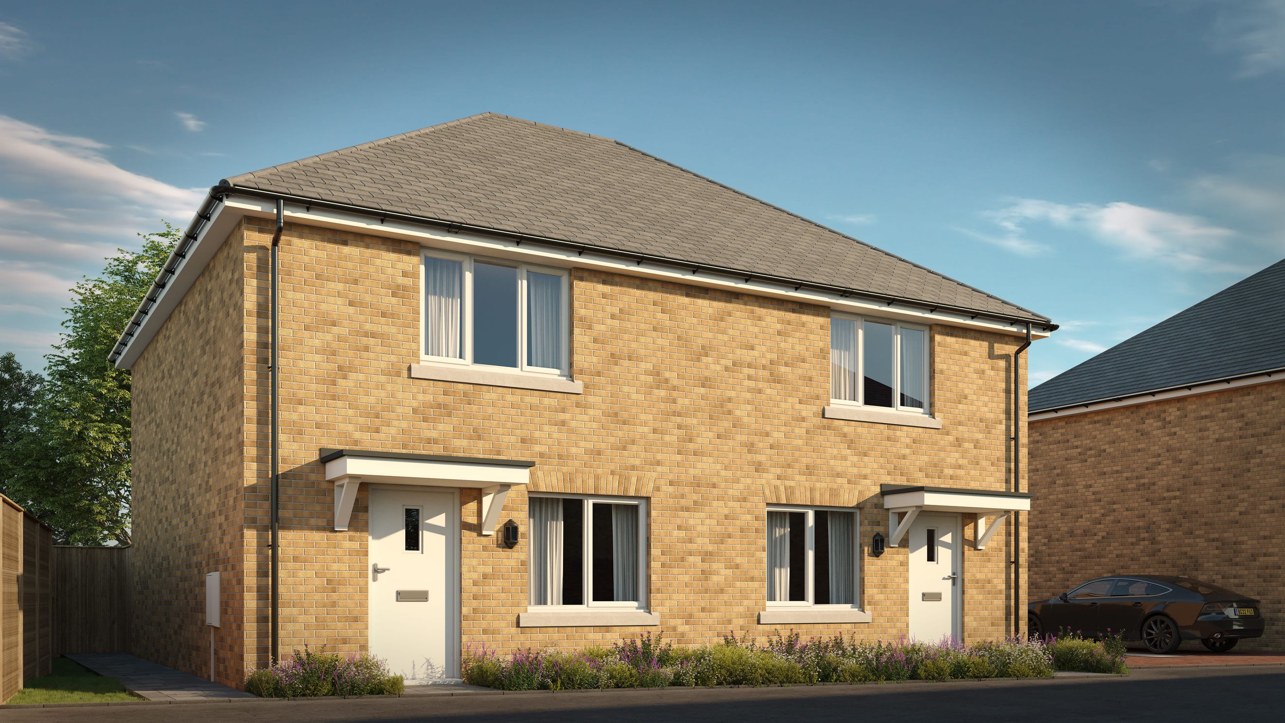 A pair of semi-detached houses with yellow brick exteriors and grey tiled roofs.