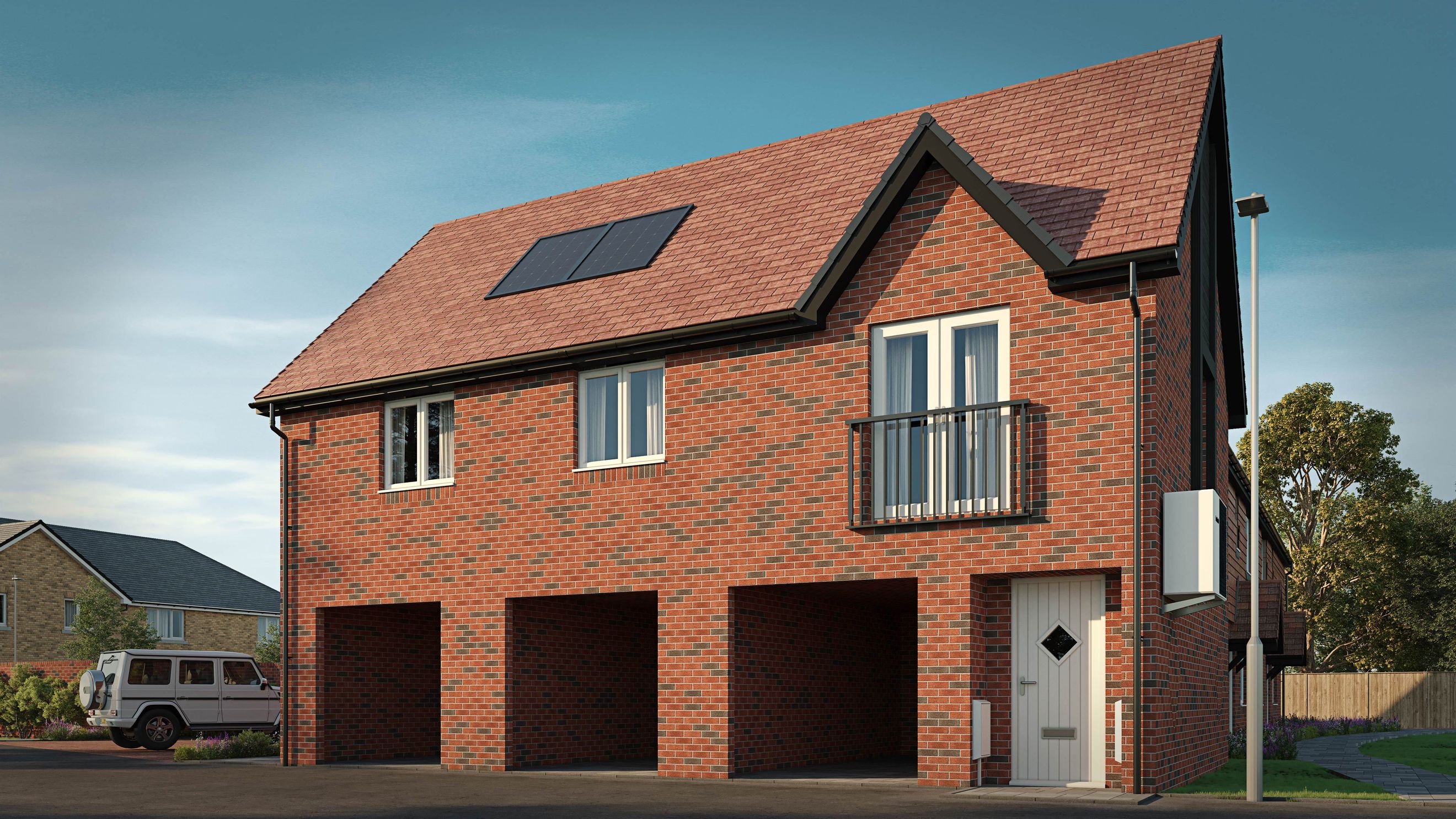 A brick house with a double garage, balcony, and solar panels on the roof.