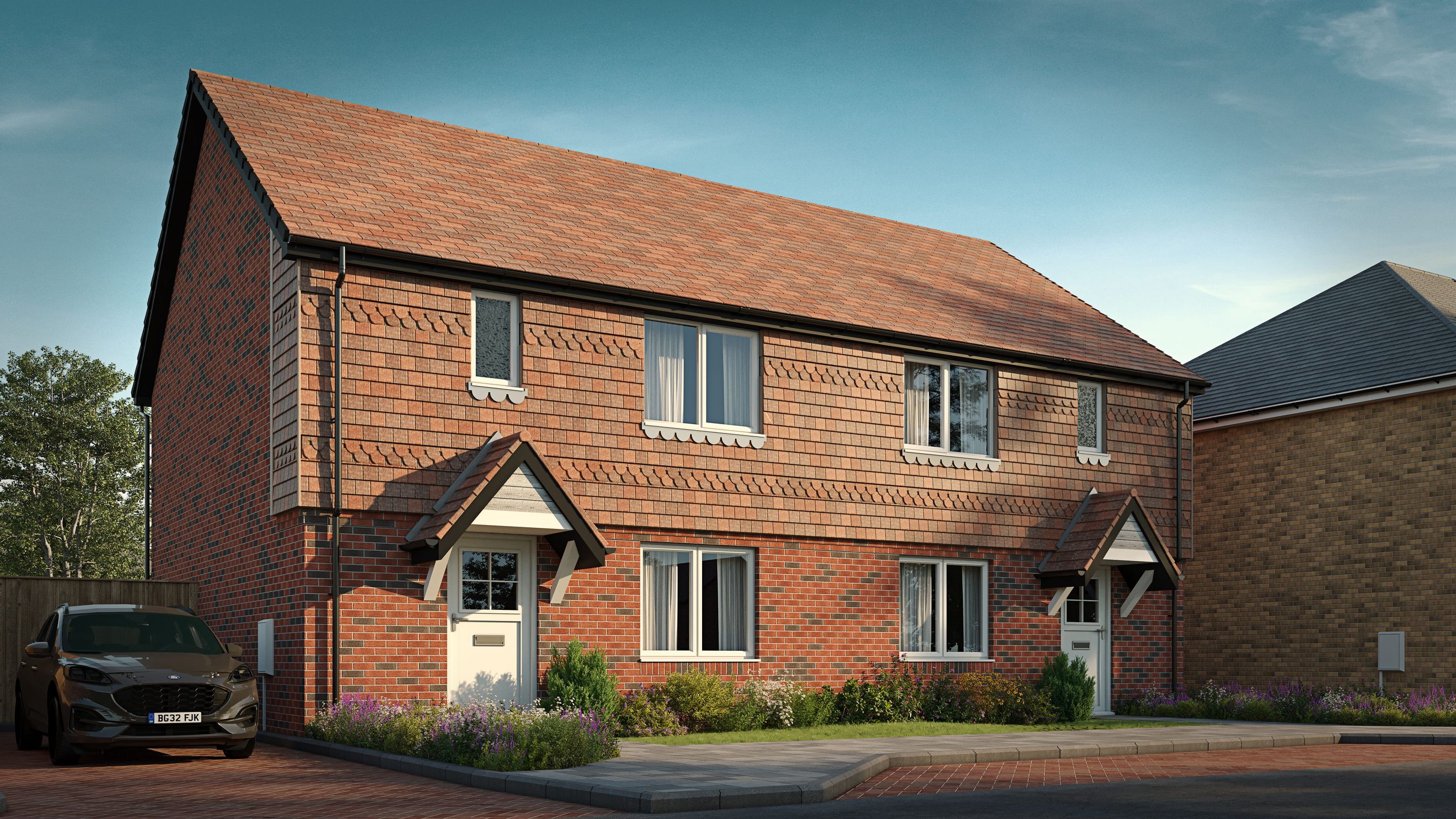 A pair of semi-detached brick houses with tiled roofs and front porches under a blue sky.