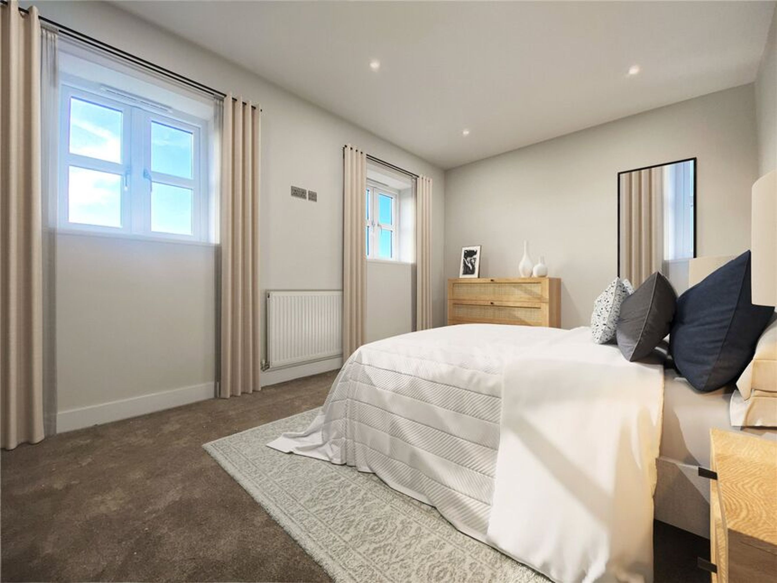 A bedroom with a bed, windows, curtains, and a dresser.