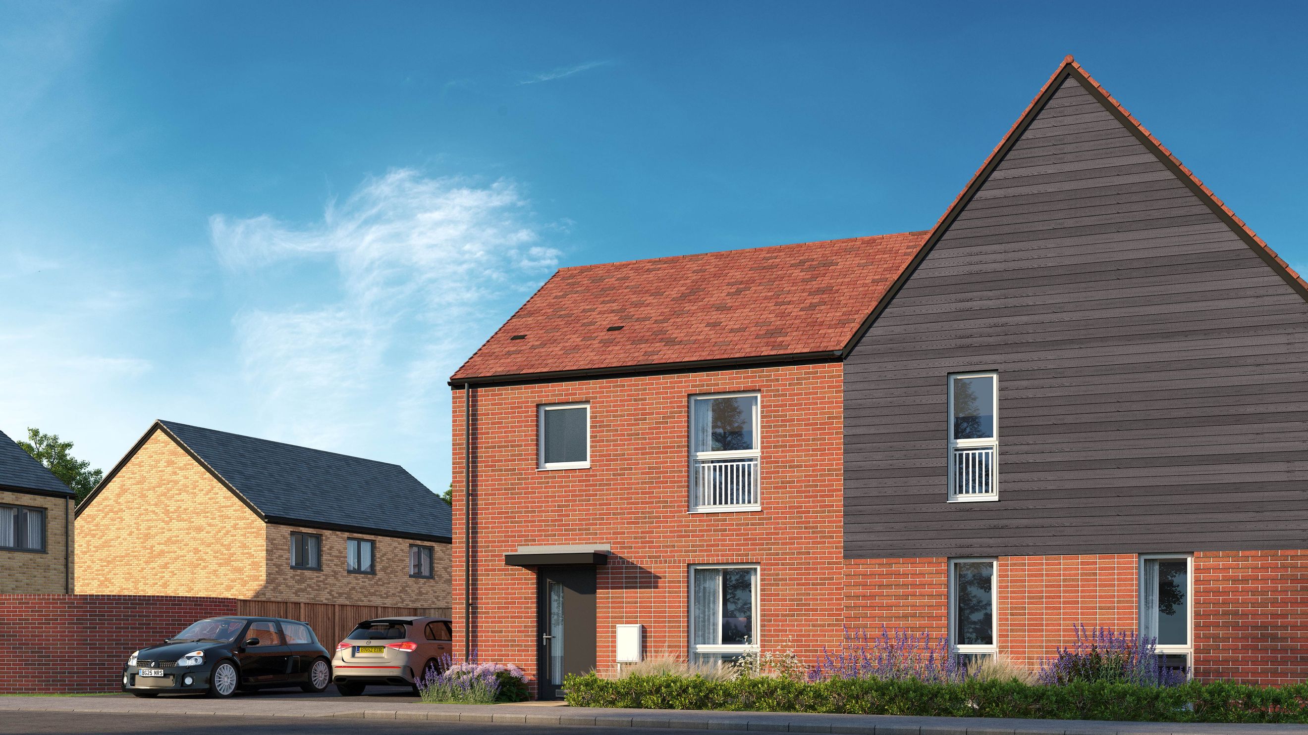 A modern house with red brick and dark timber cladding, featuring multiple windows and a pitched roof.