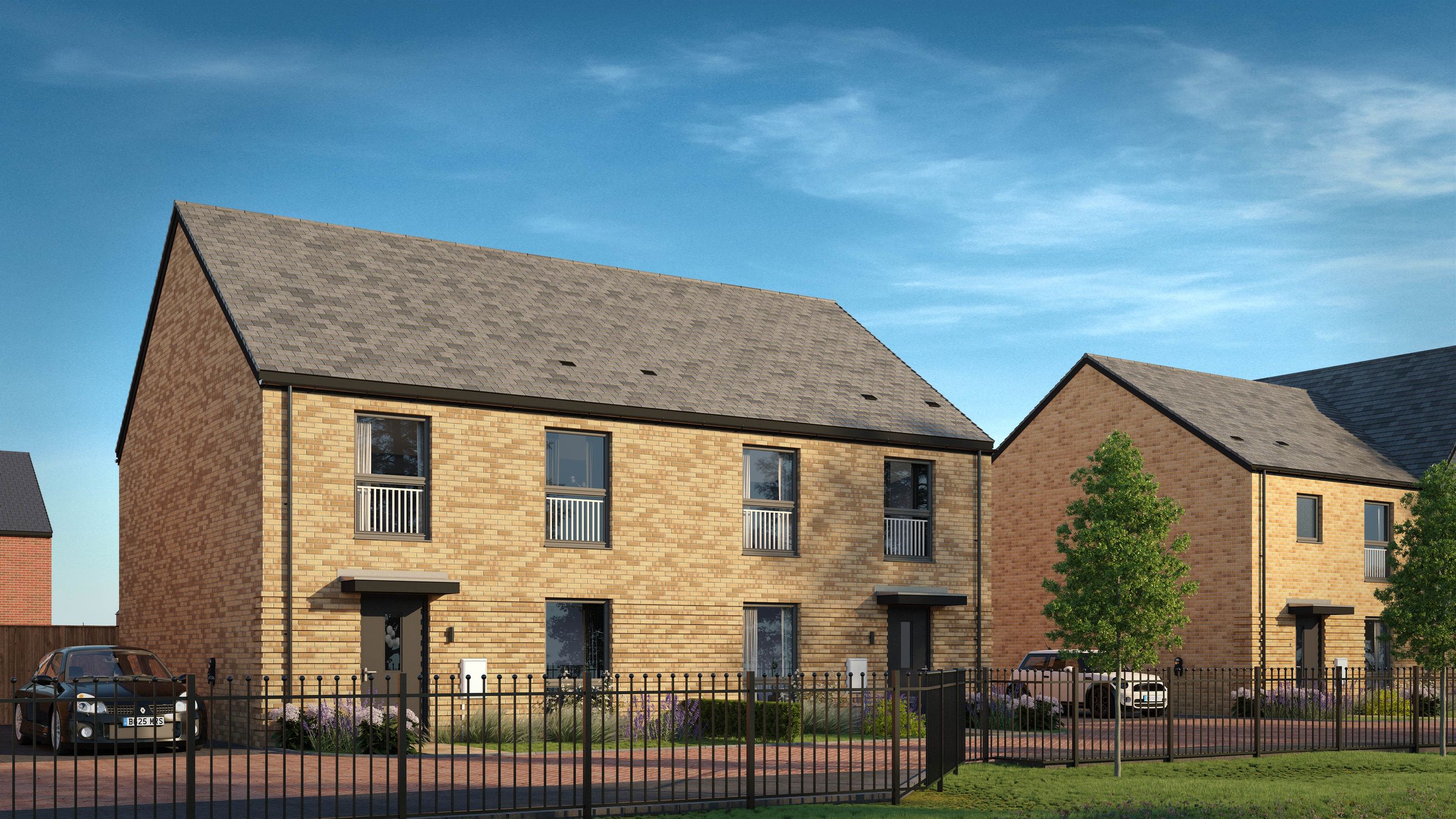 A row of modern brick houses with asphalt shingle roofs under a blue sky.