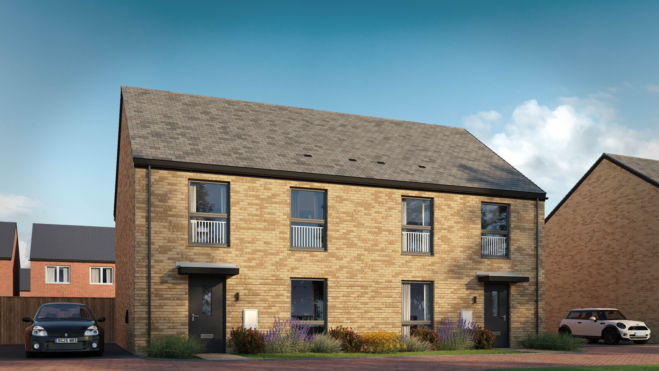 A row of modern brick houses with cars parked in front.