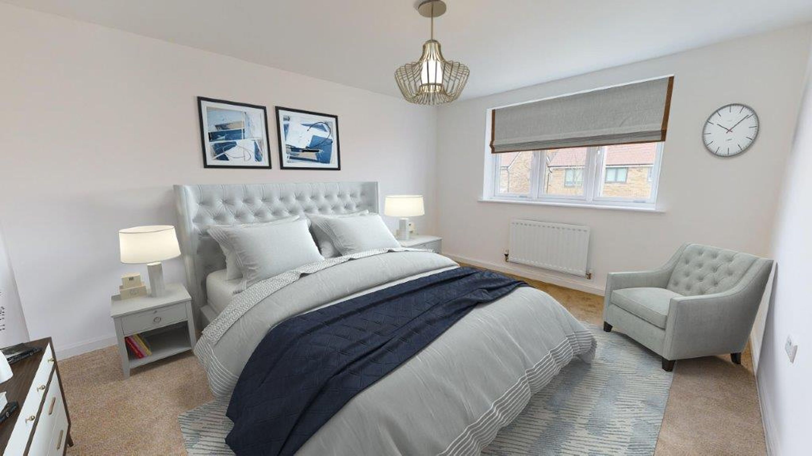 A bedroom with a bed, two bedside tables, a chair, and artwork.