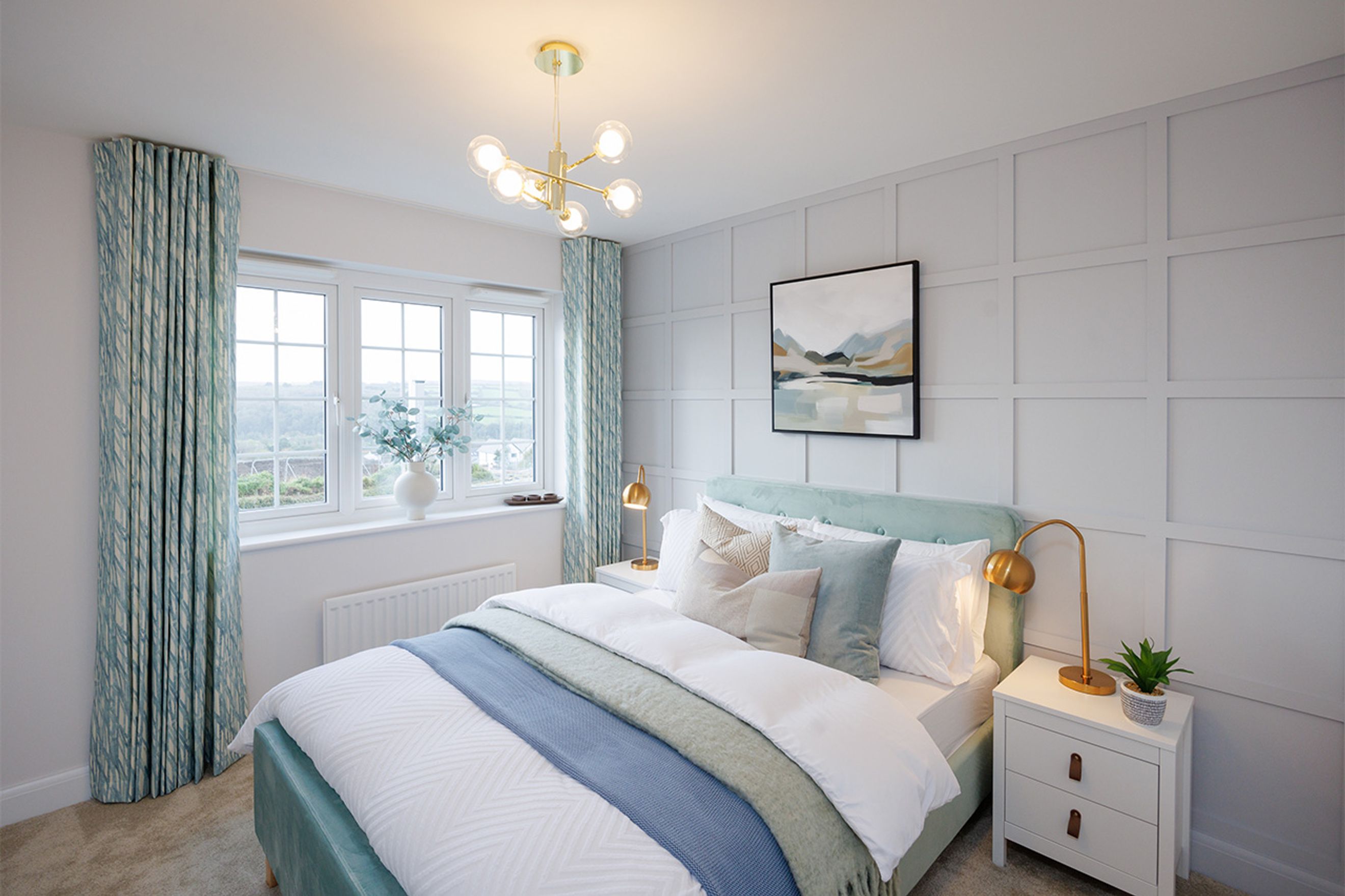 A bedroom with a bed, curtains, and a window.
