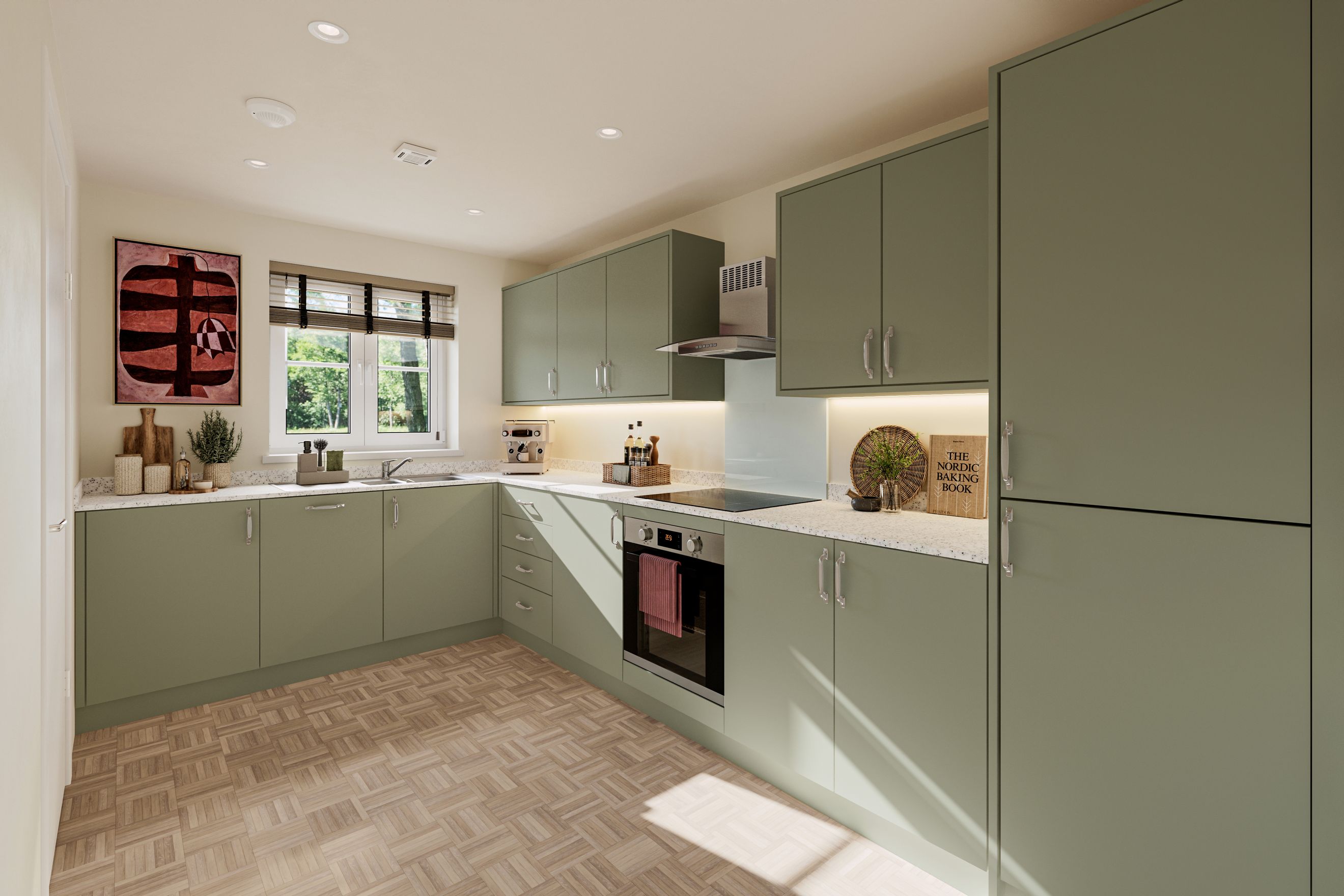 A kitchen with sage green cabinets, a speckled countertop, and parquet flooring.