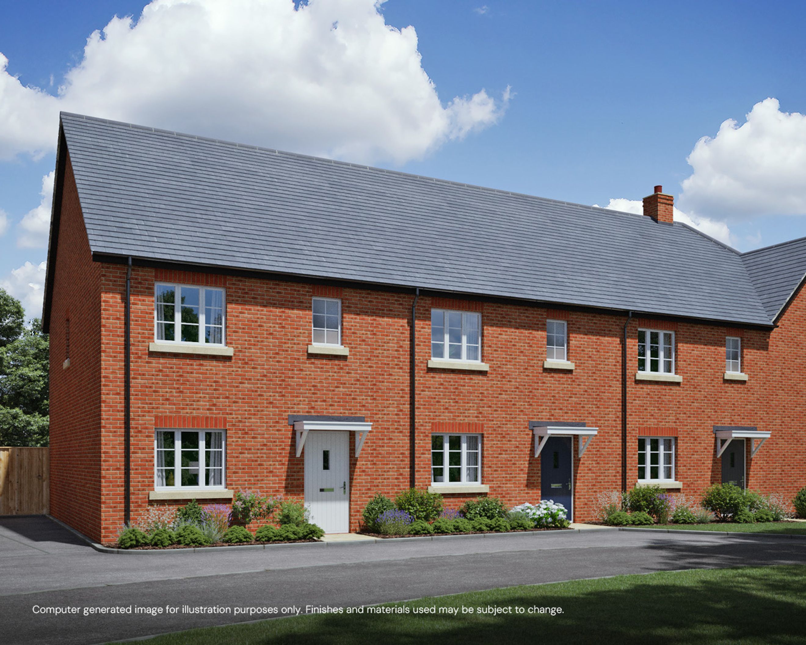 A row of brick townhouses with pitched roofs and windows.