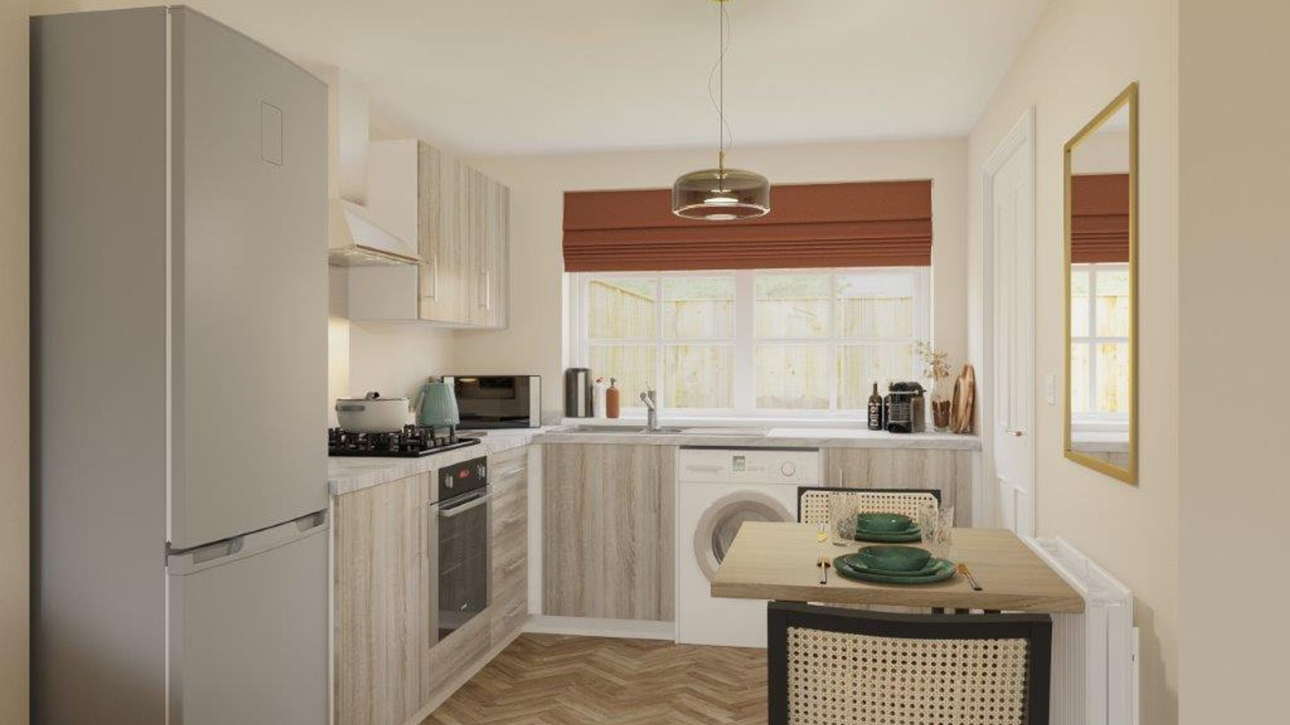 A kitchen with a refrigerator, oven, microwave, sink, washing machine, and a small dining table.