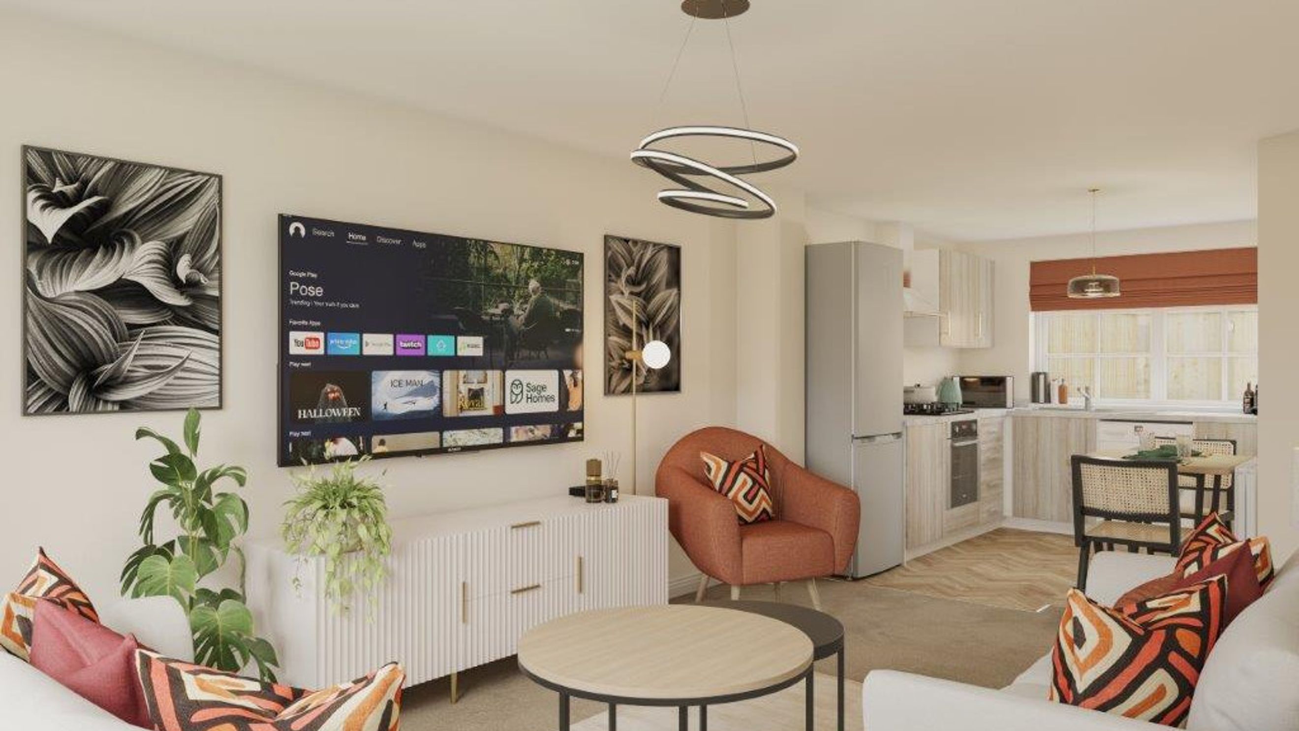 A living room and kitchen area with a television, sofa, chairs, and kitchen appliances.