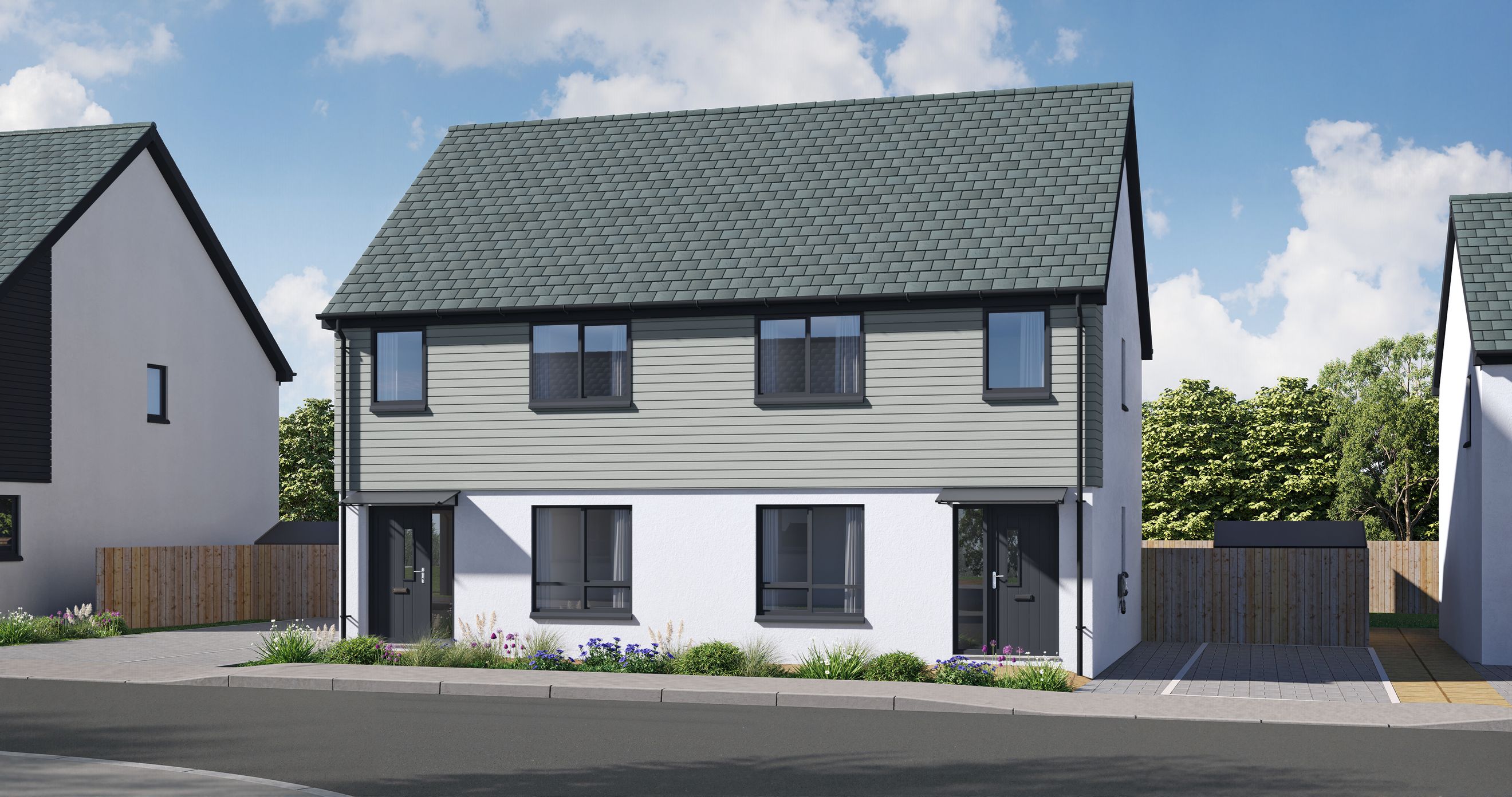 A modern semi-detached house with grey tiled roof and light grey horizontal cladding.