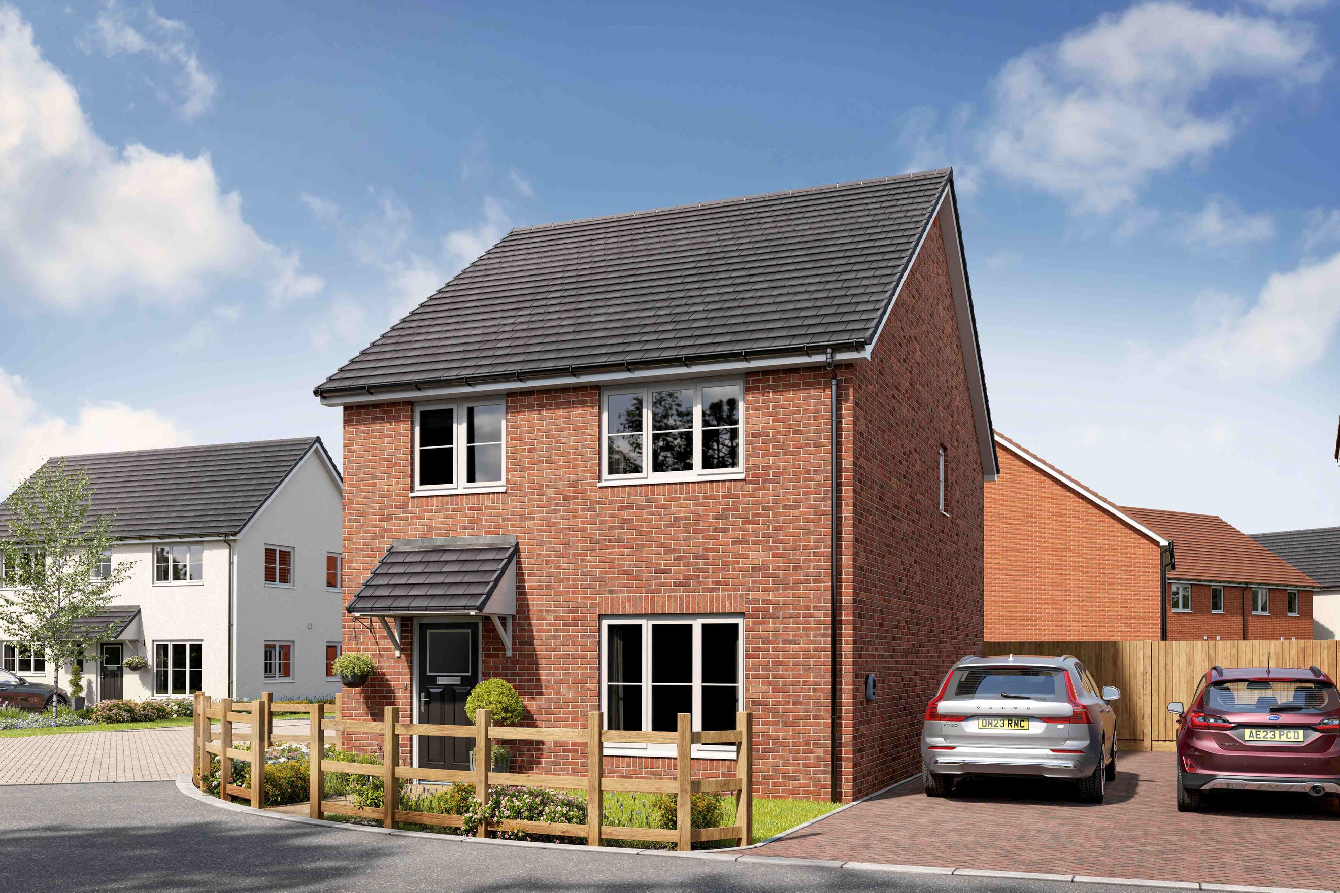 A brick house with a driveway and two cars.