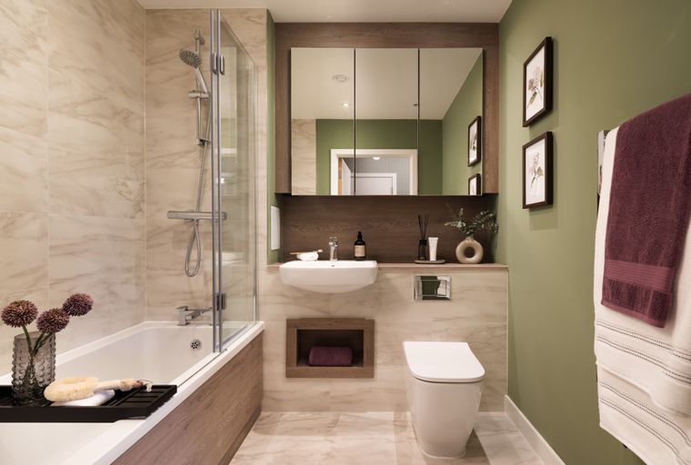A bathroom with a bathtub, shower, sink, and toilet.