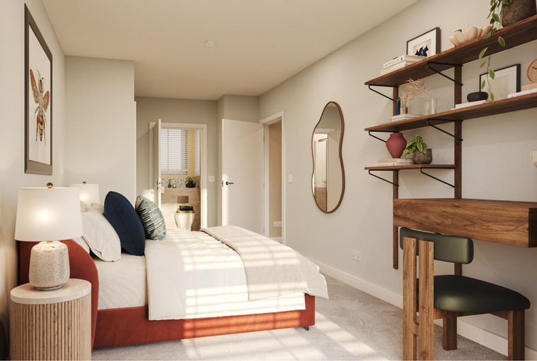 A bedroom with a bed, bedside tables, a desk, and shelves.