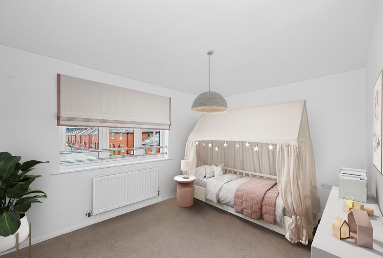 A child's bedroom with a canopy bed, a side table, and a window.