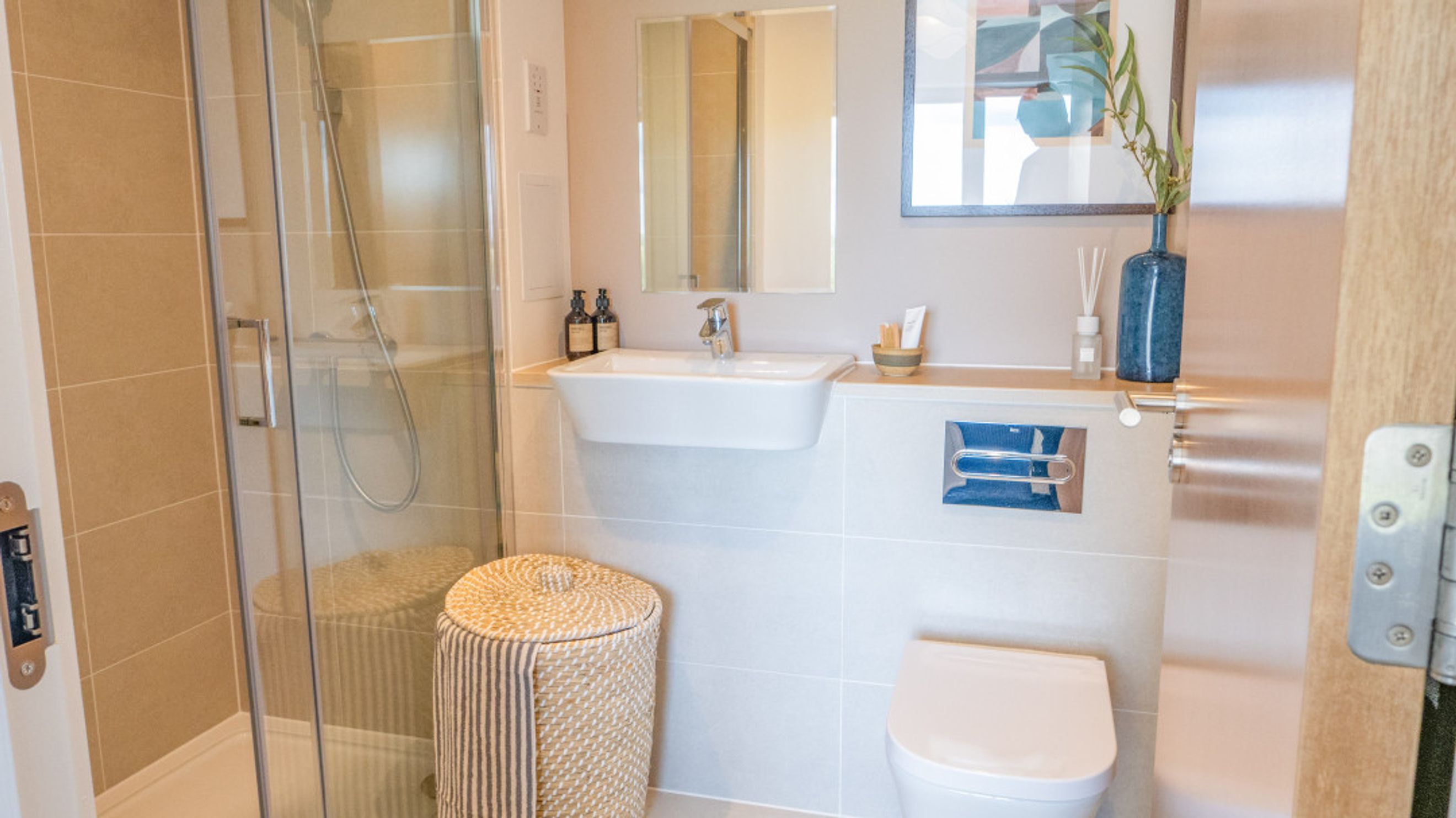 A bathroom with a shower, sink, and toilet.