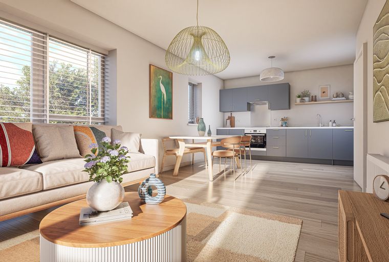 A living room and kitchen area with a sofa, dining table, and kitchen cabinets.