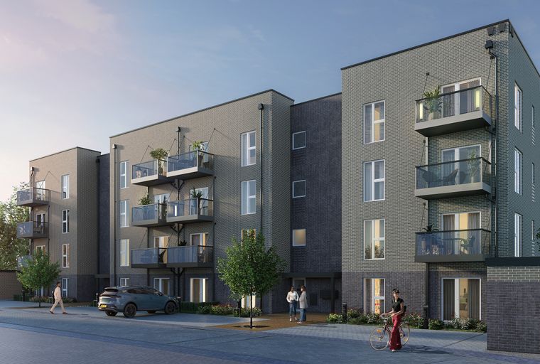 A modern apartment building with grey brick facade and balconies.