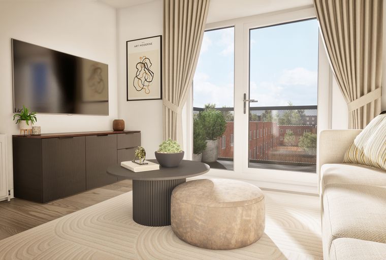 A living room with a sofa, coffee table, and a large television.