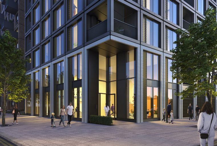 A modern apartment building with large windows and trees lining the sidewalk.