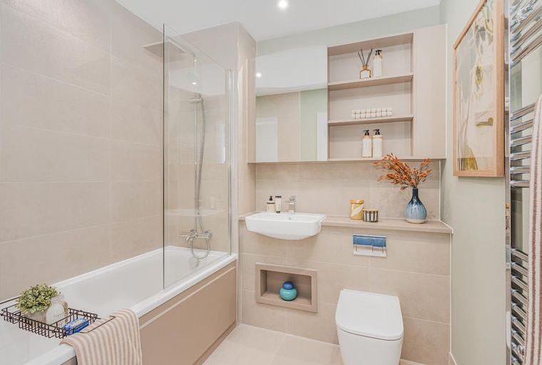 A bathroom with a bathtub, shower, sink, and toilet.