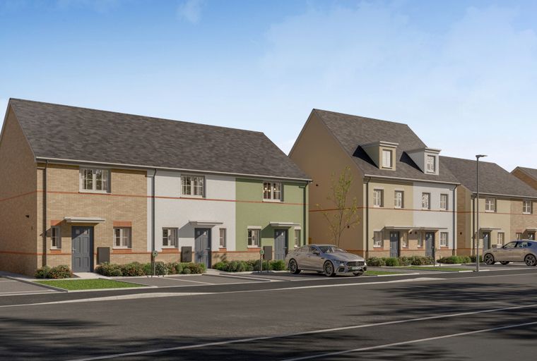 A row of modern houses with pitched roofs and parked cars on a street.