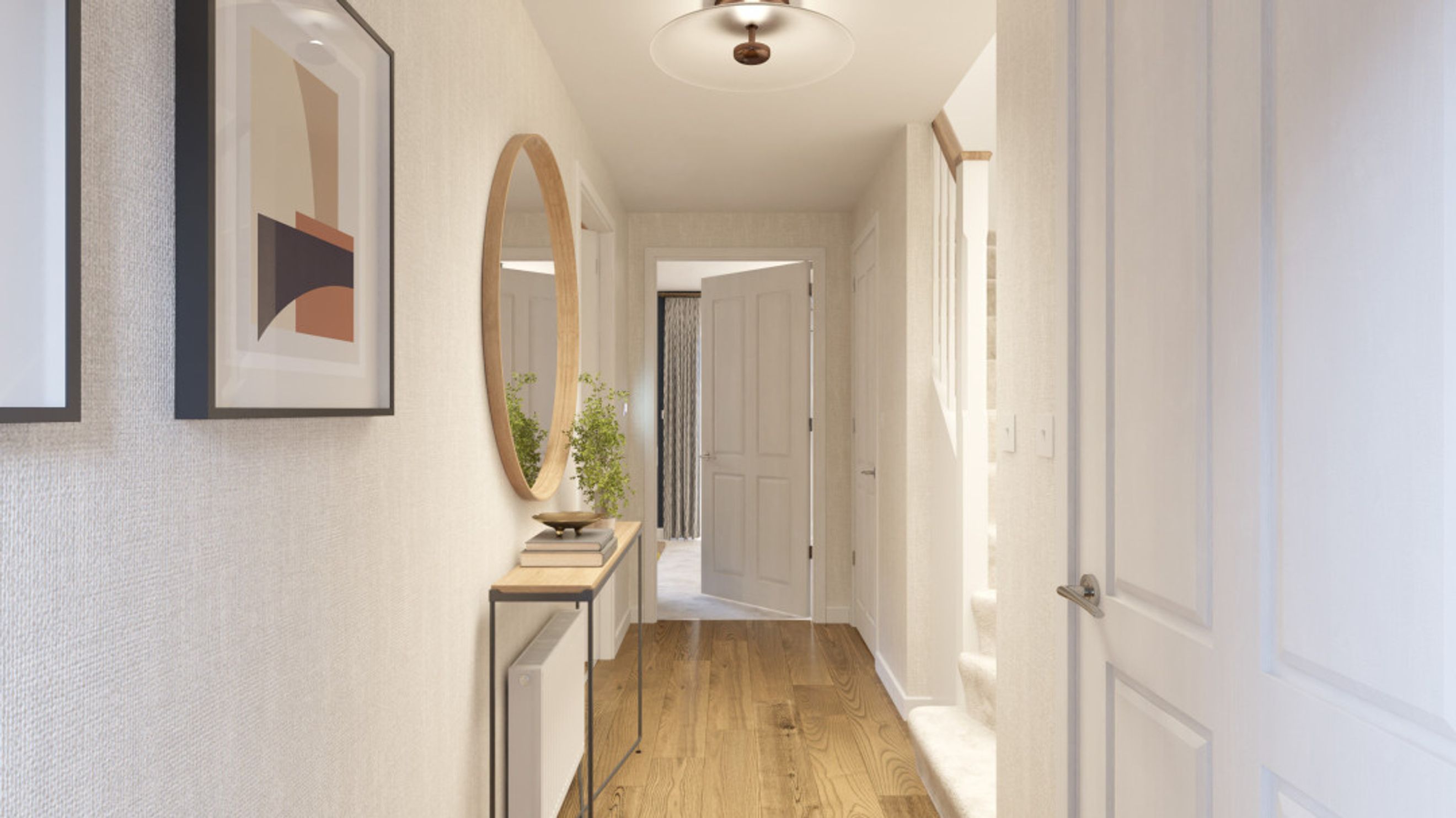 A hallway with a console table, mirror, artwork, and wooden flooring.