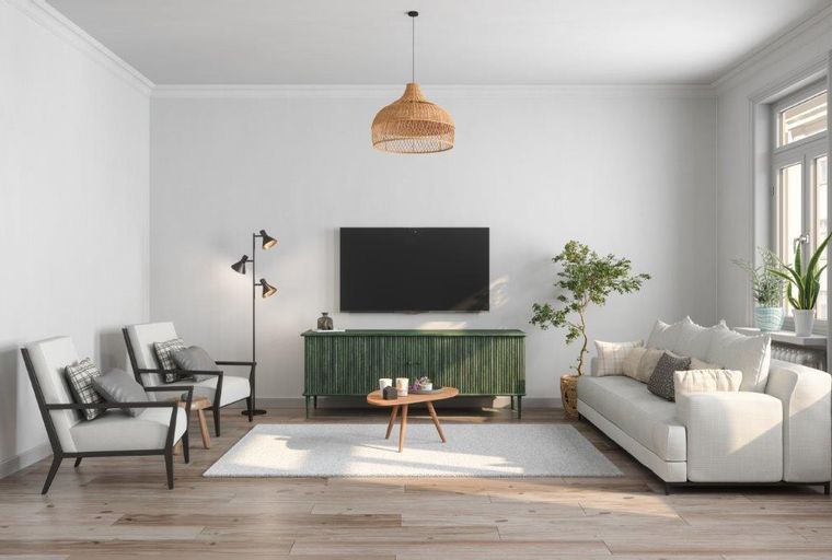 A living room with a sofa, chairs, a TV, and a coffee table.