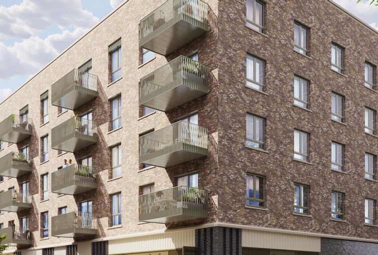 A modern apartment building with multiple balconies and brick exterior.