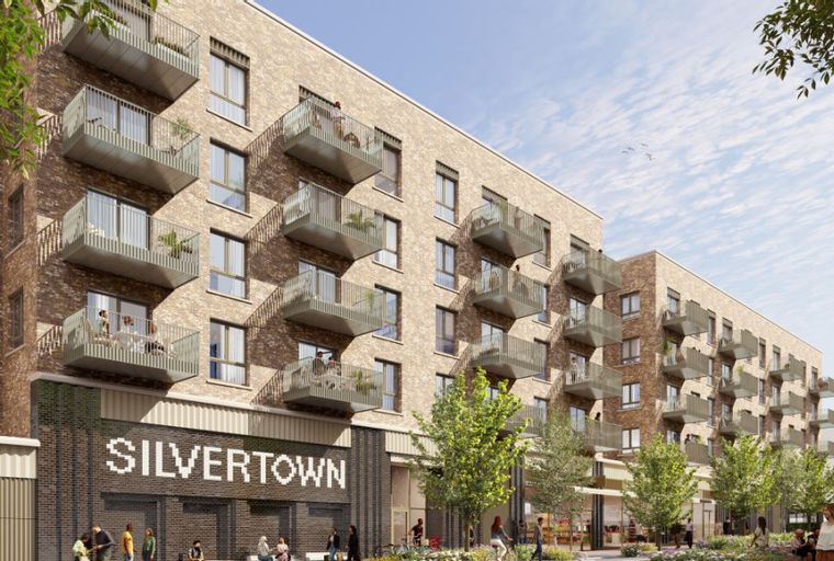 A modern apartment building with multiple balconies and ground-floor retail spaces.