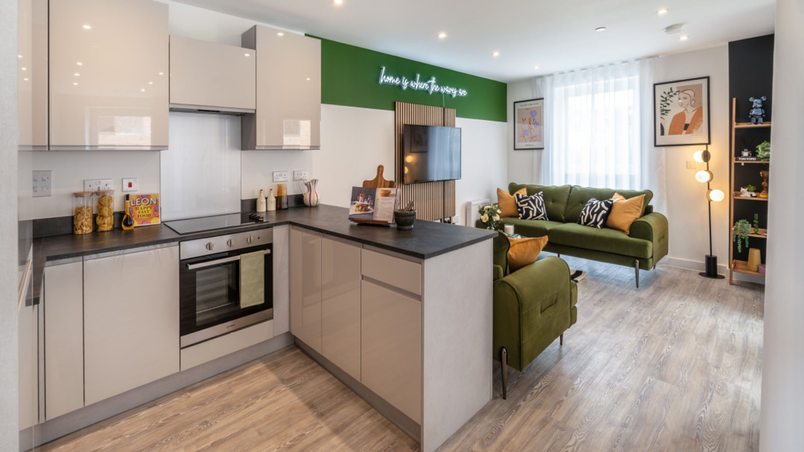 A modern apartment with a kitchen and a living room.