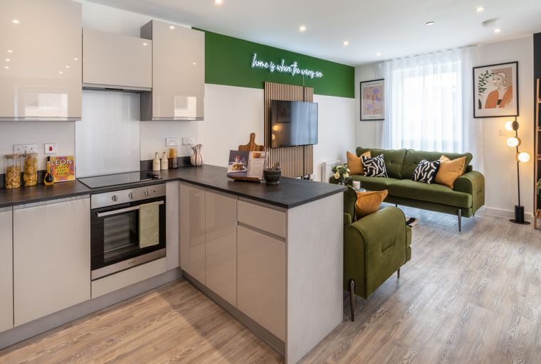 A modern apartment with a kitchen and a living room.