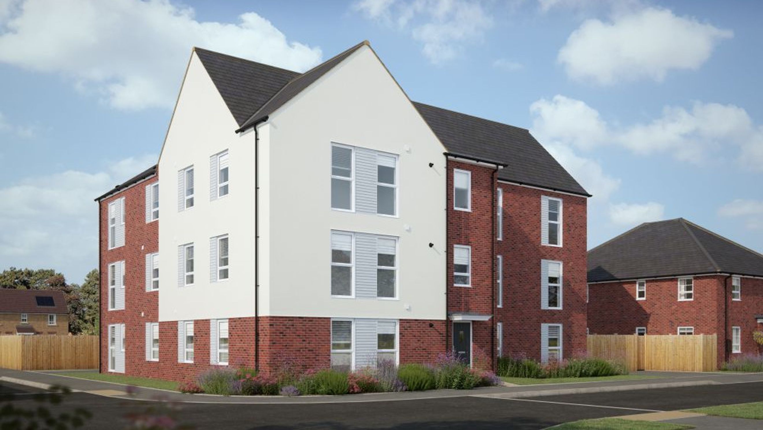 A modern apartment building with red brick and white render facades.