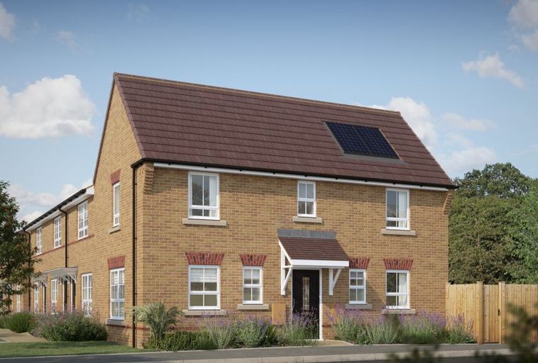 A brick townhouse with solar panels on the roof and white-framed windows.