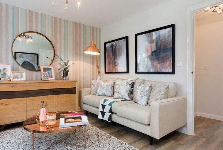 A living room with a sofa, coffee table, and sideboard.
