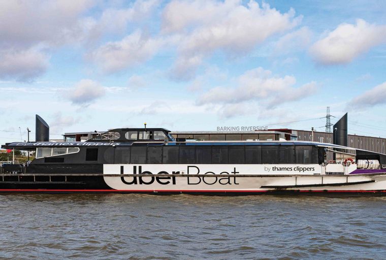 A boat named Uber Boat by Thames Clippers is on the water.
