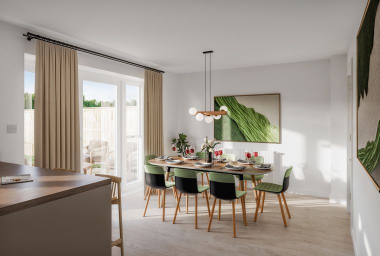 A dining room with an oval table, chairs, and a large window with curtains.