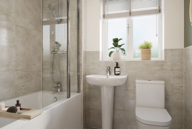 A bathroom with a bathtub, shower, sink, and toilet.