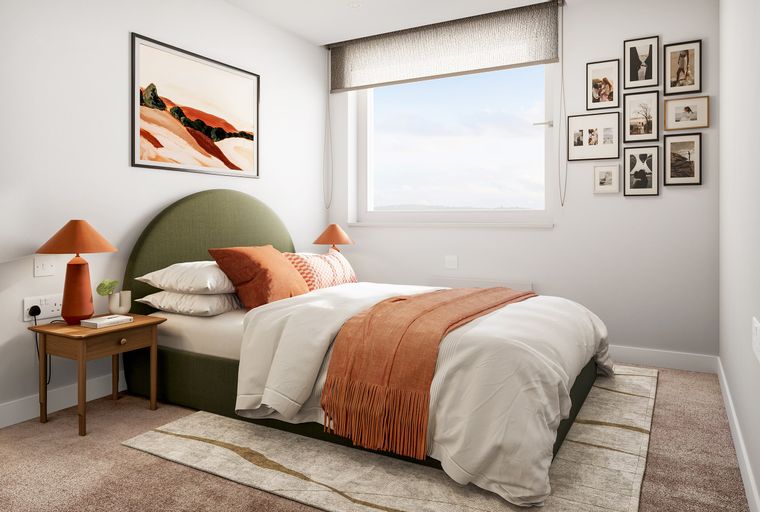 A bedroom with a bed, nightstand, and a window.