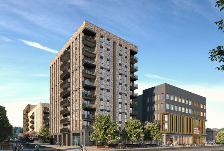 A modern apartment complex with retail spaces on the ground floor and balconies on the upper levels.