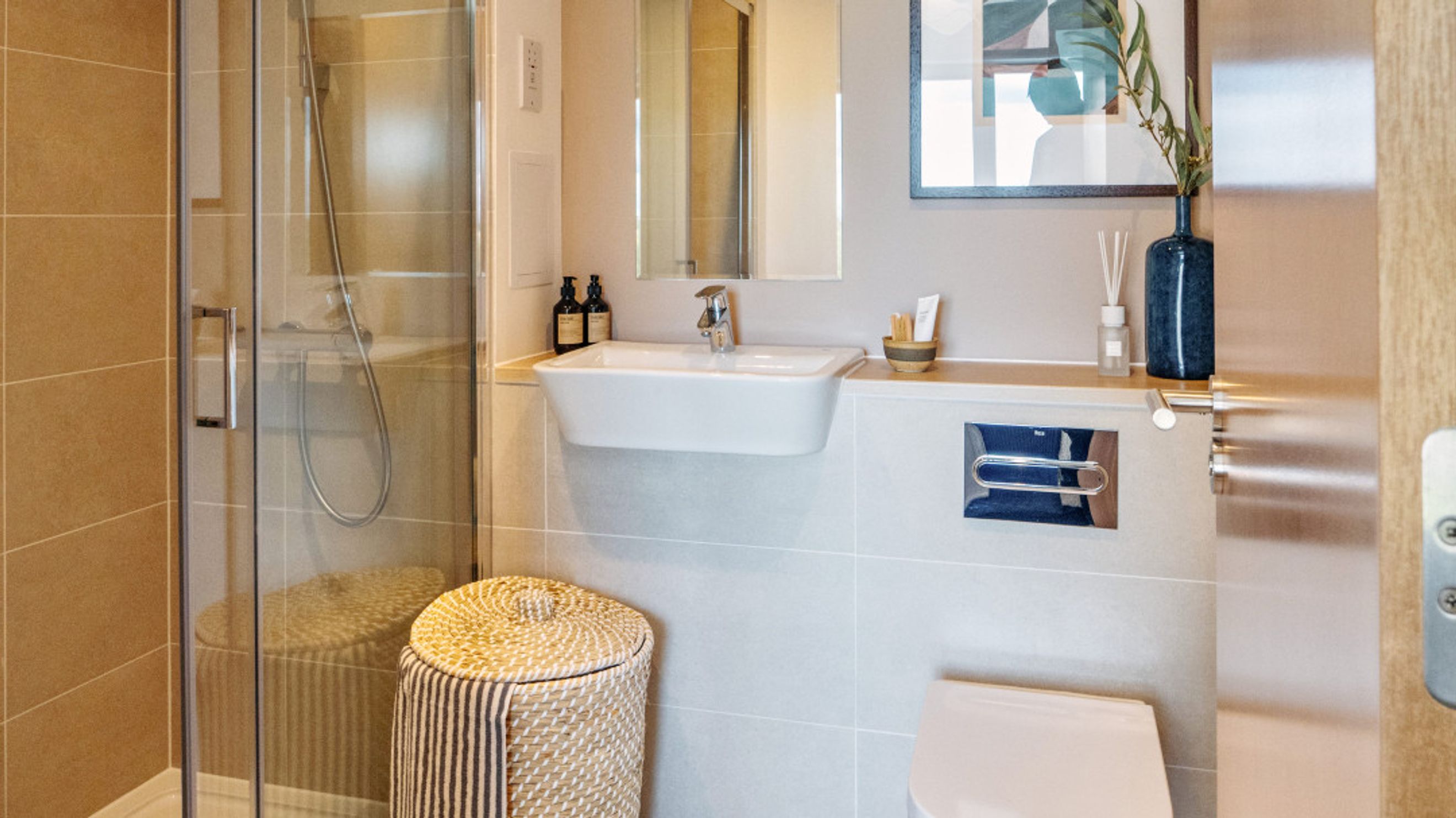 A bathroom with a shower, a sink, and a toilet.