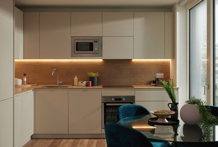A modern kitchen with integrated appliances, under-cabinet lighting, and a dining area.