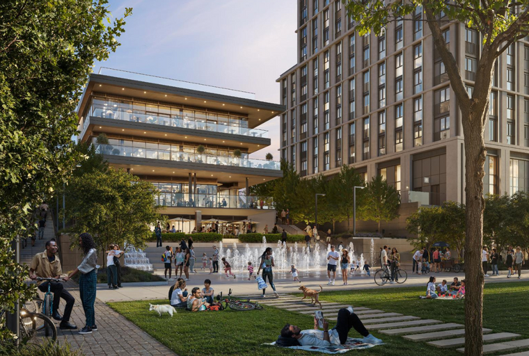 A modern building complex with people enjoying a plaza and fountains.