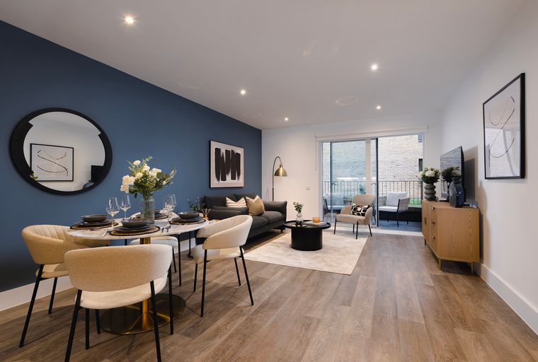 A dining and living area with a marble-top table, chairs, a sofa, and a coffee table.